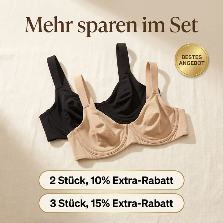 Black and beige balconette bras laid flat on cream fabric.