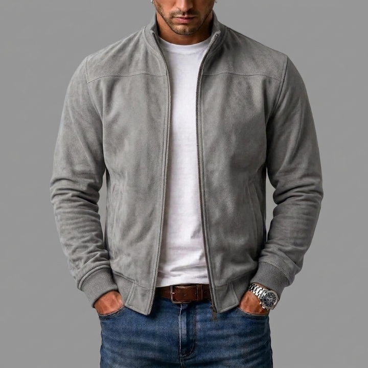 Light gray suede bomber worn open by a model over a white tee and jeans, with ribbed cuffs. 7