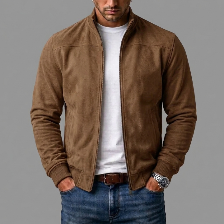 Camel brown suede bomber worn open by a model over a white tee, jeans and a brown belt. 5