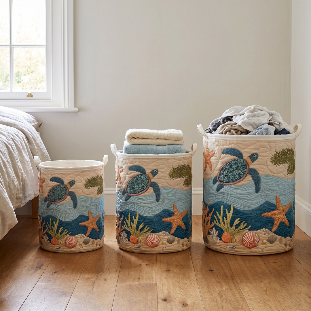 Quilted laundry basket with canvas handles in three sizes on a wood floor.
