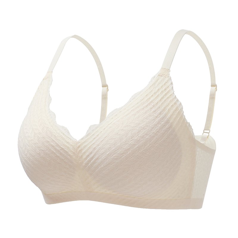 Cream bralette on a plain white background, showing the thin adjustable straps and soft textured cups.