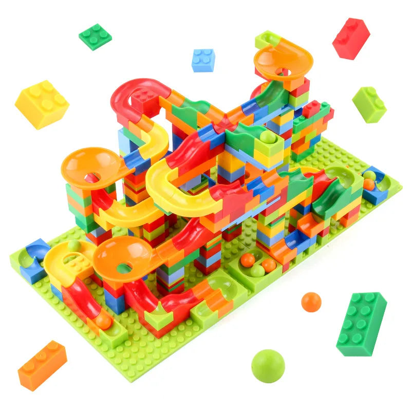 Assembled multicolor marble run building set on a green baseplate with colorful slides and funnels.