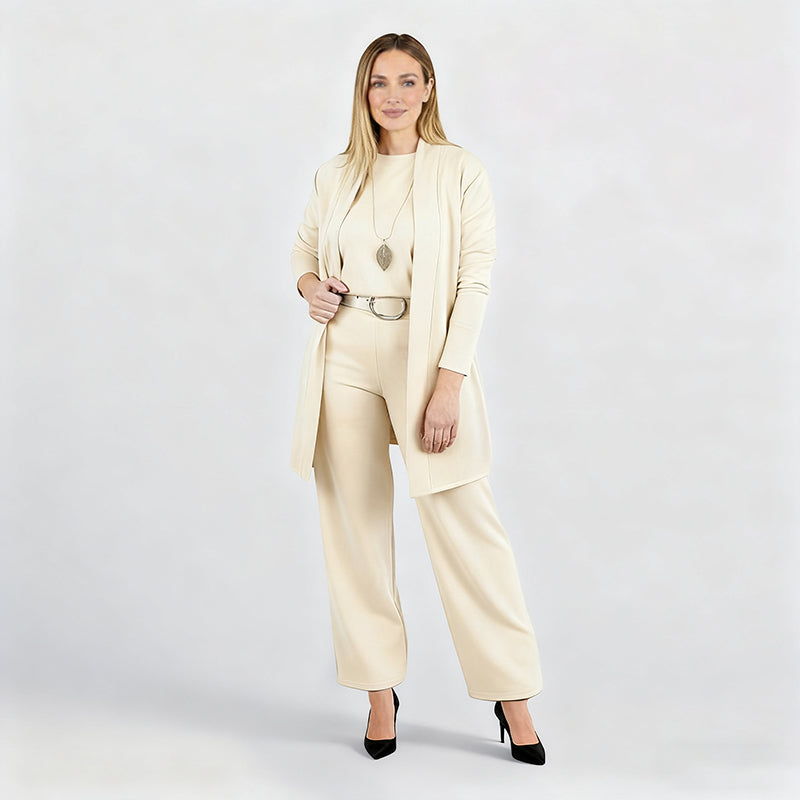 Full-length studio shot of the cream cardigan, top and wide-leg pants set.