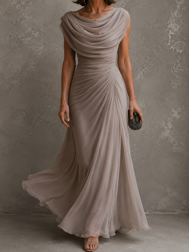 Taupe dress another view showing the layered chiffon skirt in motion.