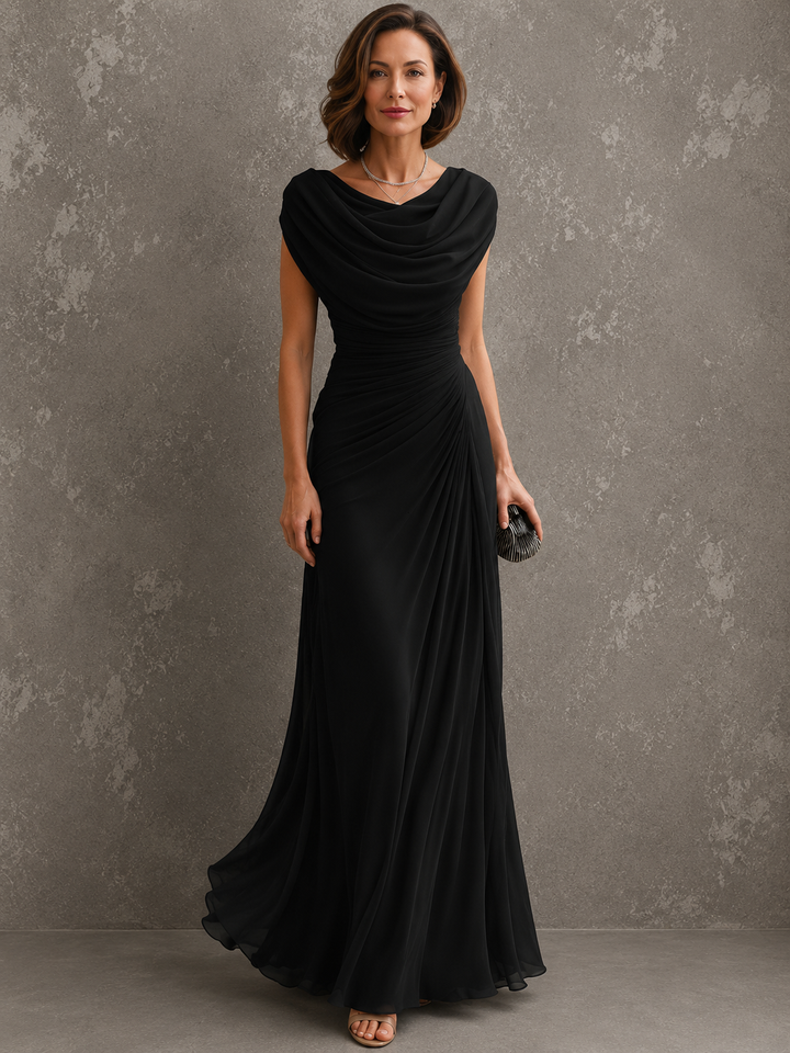 Model in the beige dress, with cap-style sleeves, draped cowl neckline and ruched side waist.