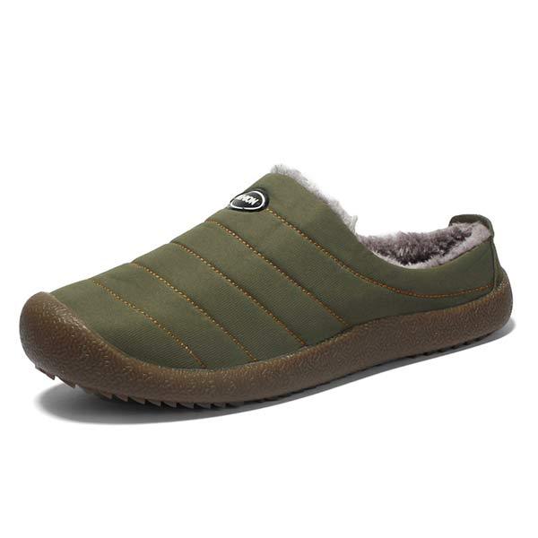 Single olive green quilted slipper with plush lining and brown sole on white background 14