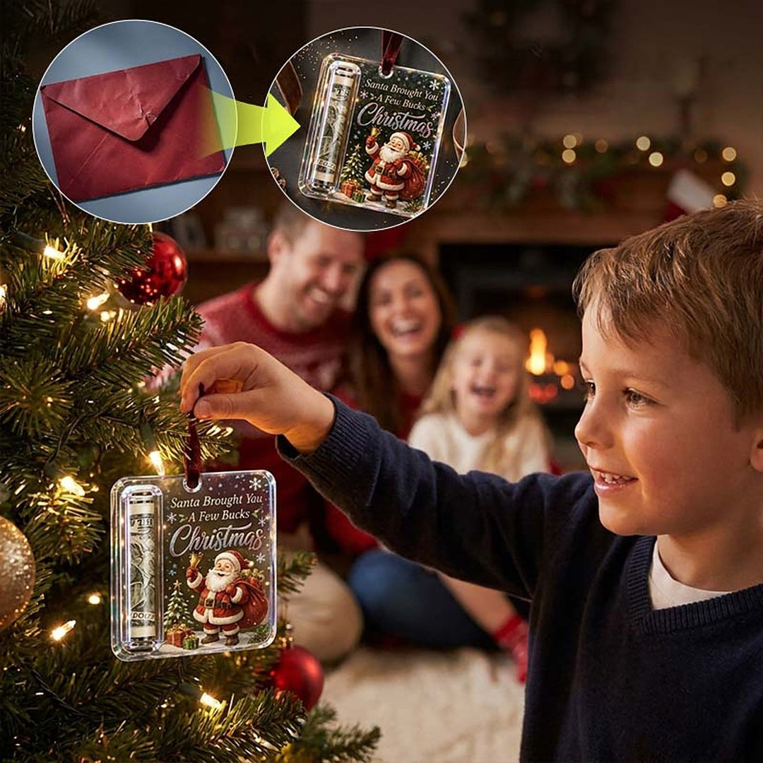 another view of a boy hanging the ornament on a tree with an inset showing an envelope turning into the ornament.