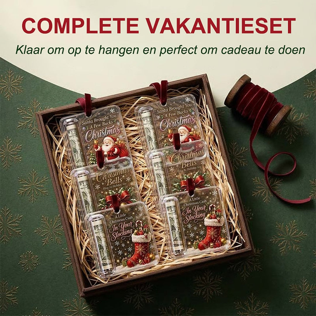another view of a gift box holding six similar acrylic money ornaments beside a spool of red velvet ribbon.