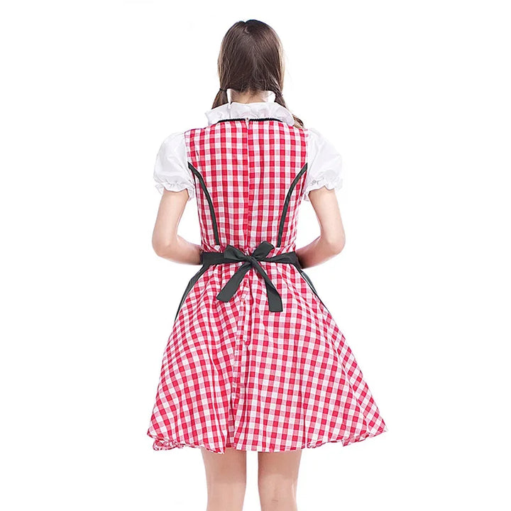Women's red gingham dirndl back view with a dark green apron and white blouse collar.