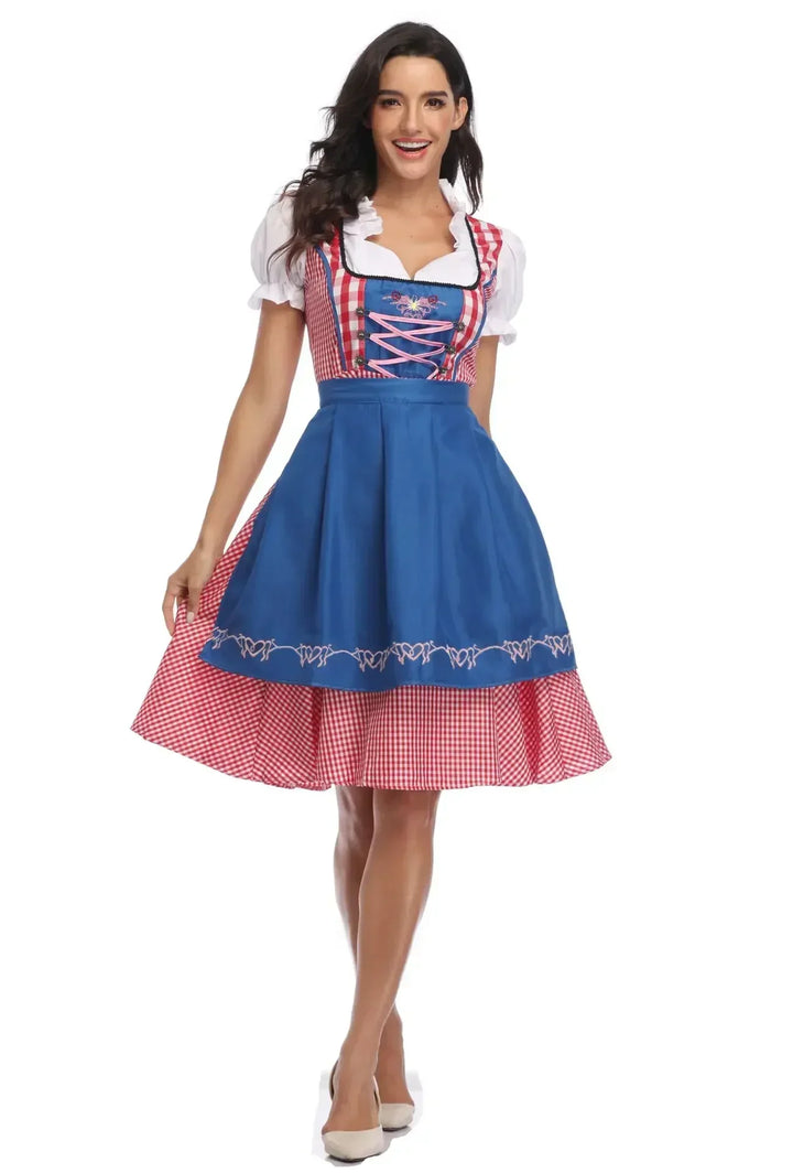Women's red gingham dirndl front view with a blue apron, pink bodice lacing and embroidered hem.