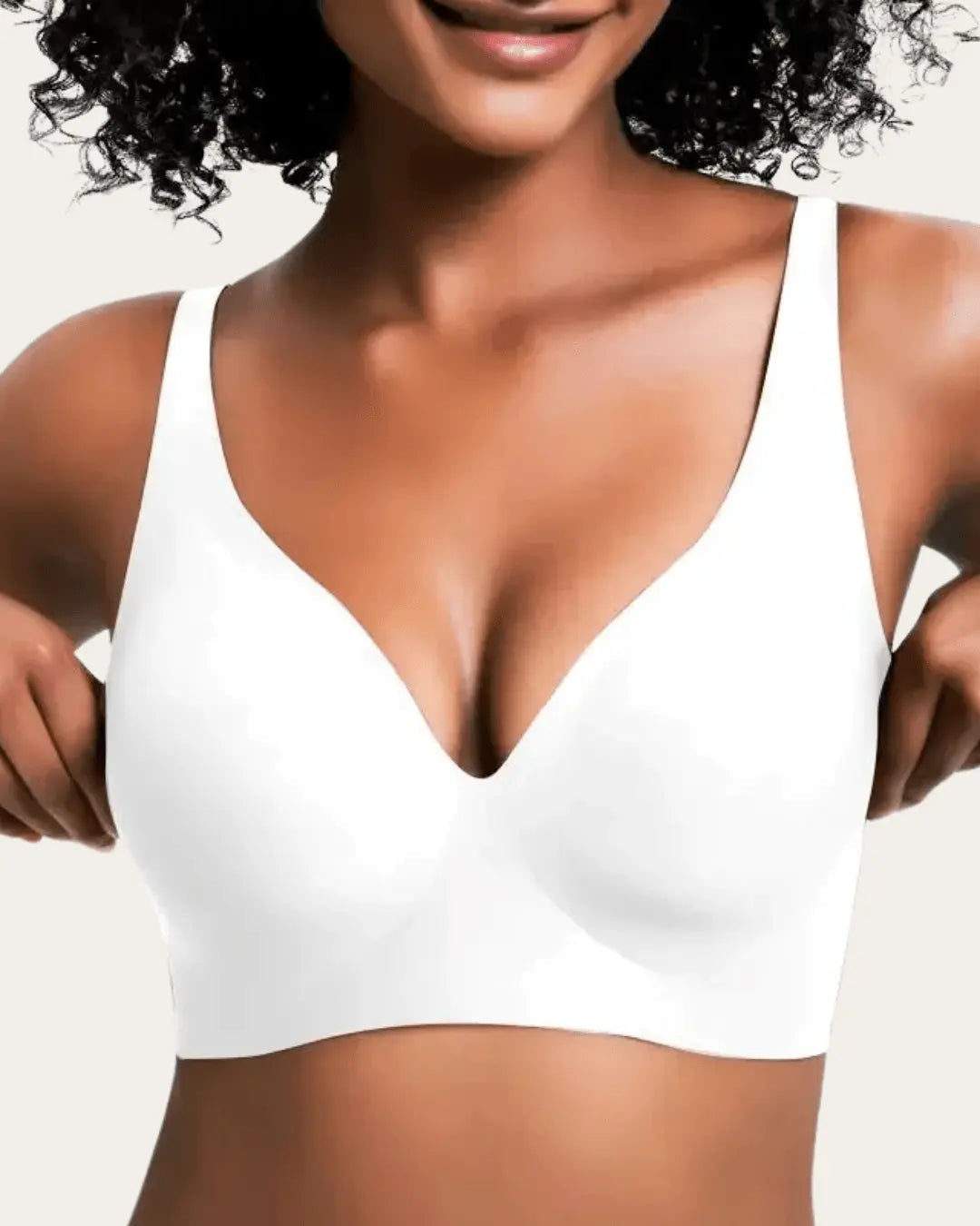Smooth wireless V-neck bra in solid white, front view on a model.