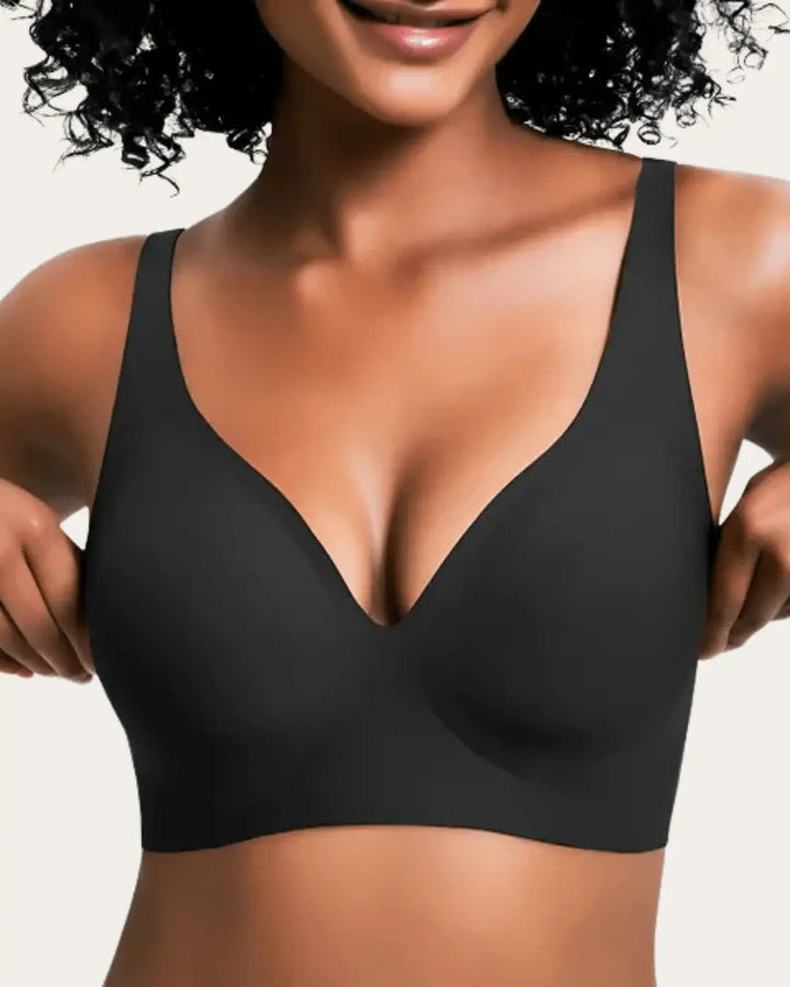 Smooth wireless V-neck bra in solid black, front view on a model.