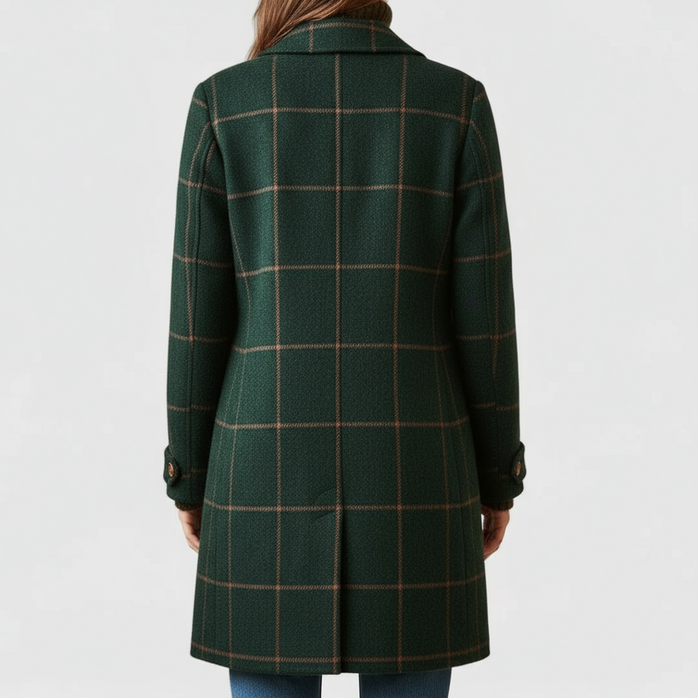 Women's plaid coat in green, back view, showing the plaid pattern, center vent and buttoned sleeve tabs.