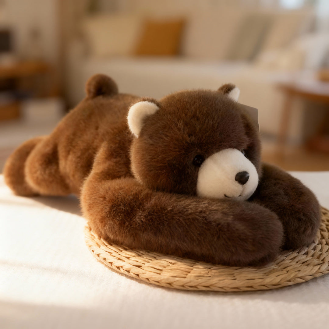 Brown bear plush with a cream muzzle lying on a woven straw mat, its long furry arms wrapped around its head. 14