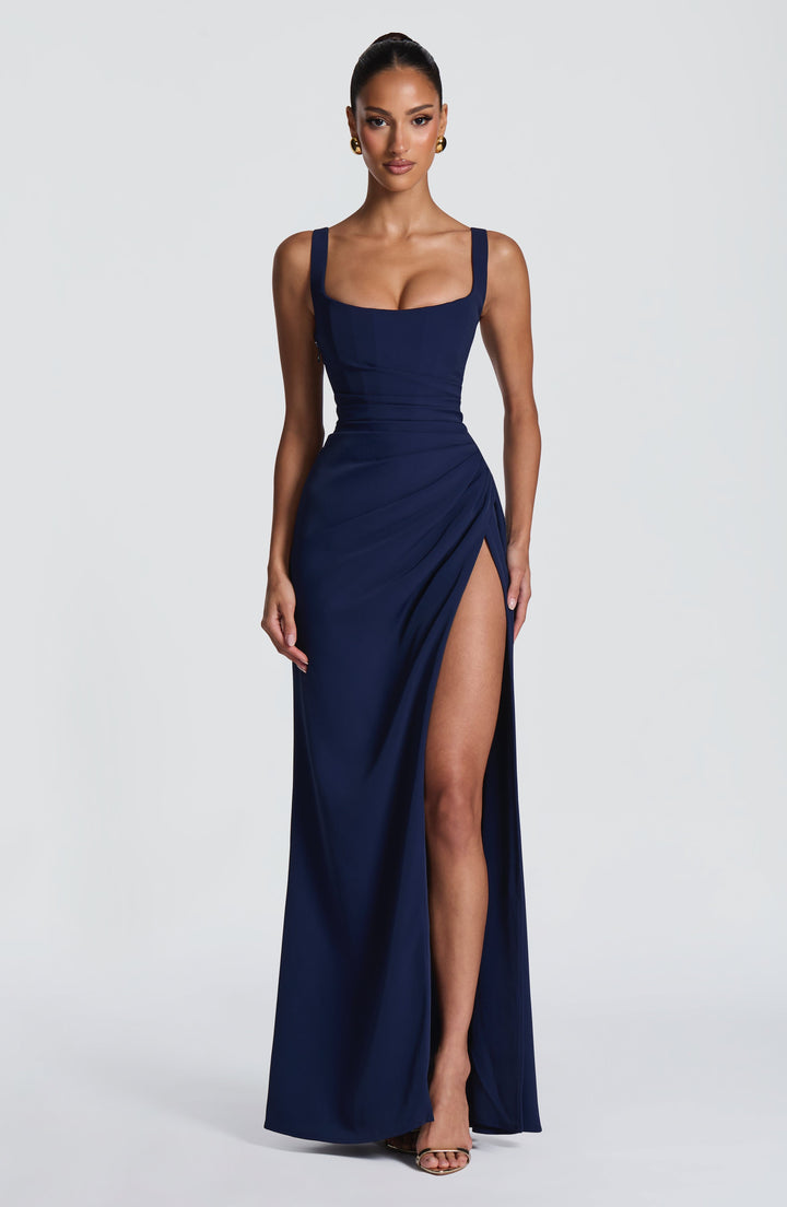 Navy Camille Maxi Dress on a model with arms relaxed, showing the full-length silhouette and high slit.