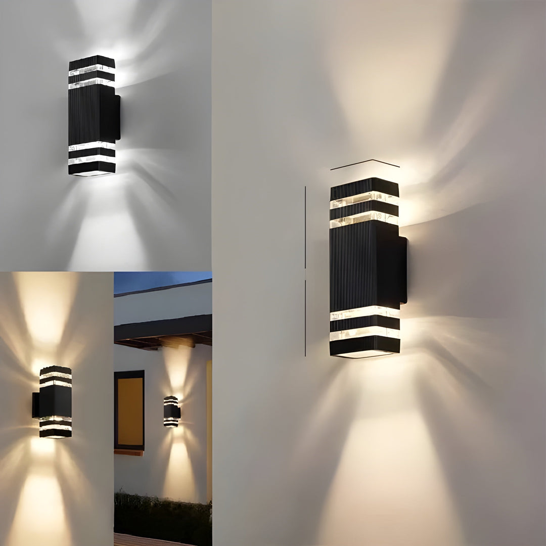 LED Outdoor Wall Light in black and transparent shown with cool white and warm glow.