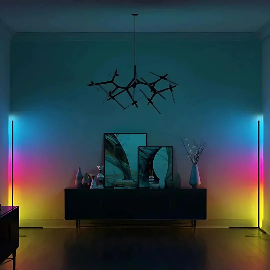 Corner lamps in multicolor gradient glow flanking a dark console and chandelier.