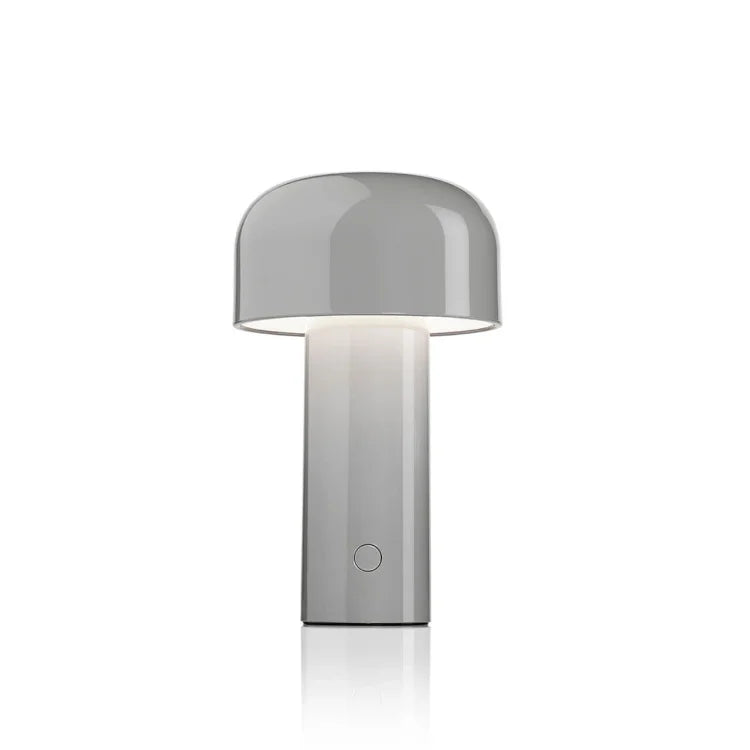 Light gray mushroom lamp lit from beneath its dome, shown on a plain white background 6