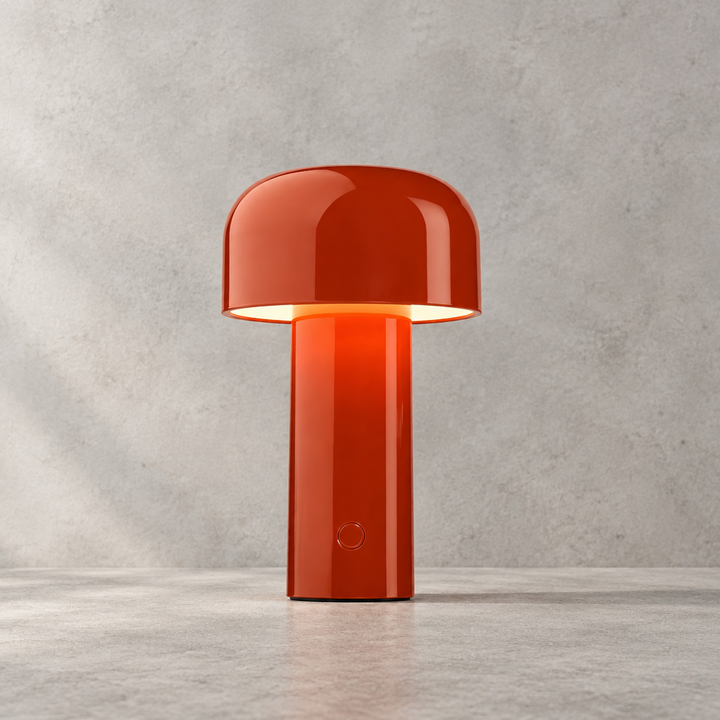 Glossy red lamp with round touch button on the stem, glowing under its dome shade 29