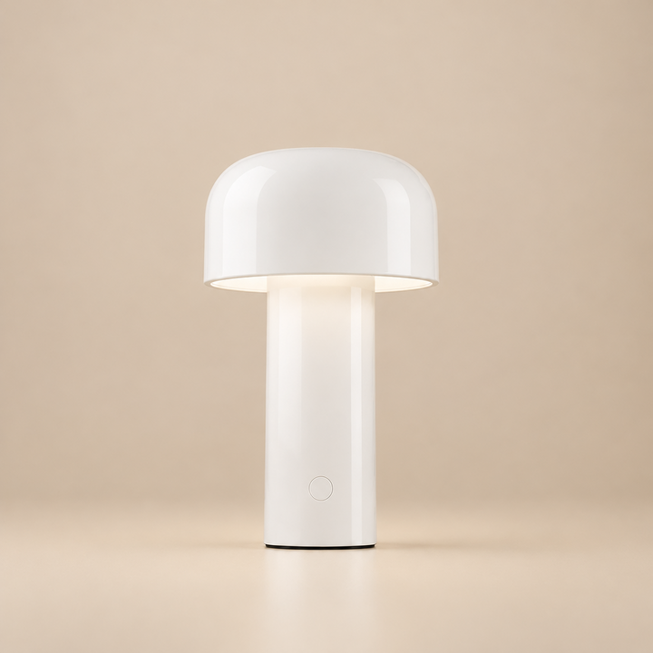 Glossy white lamp lit on a beige background, with a round power button on the base 28