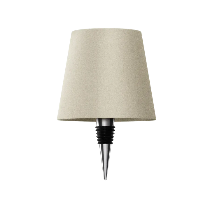 Beige bottle lamp with a chrome and black rubber bottle stopper on a white background.