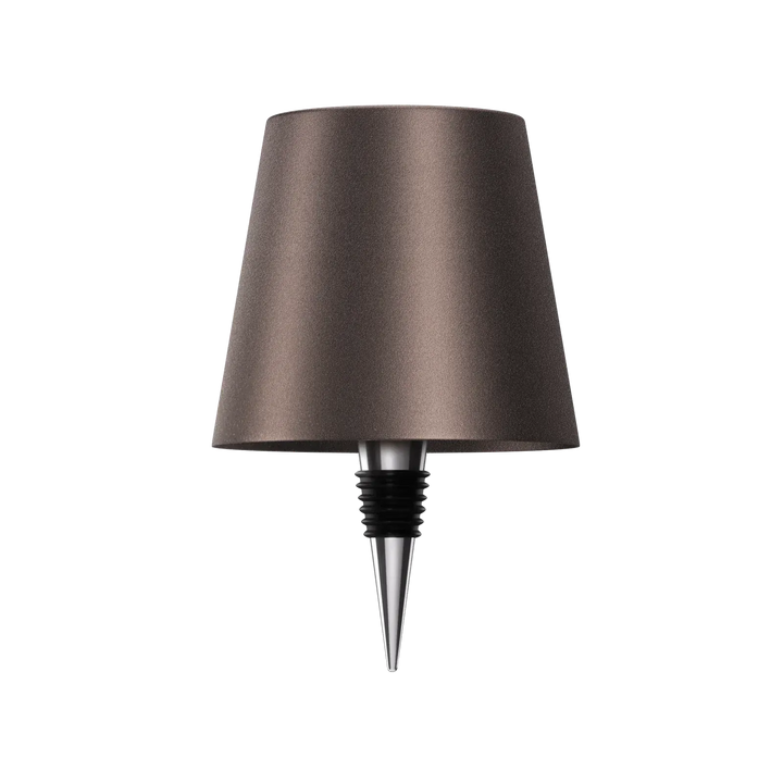 Dark brown bottle lamp with a chrome and black rubber bottle stopper on a white background.