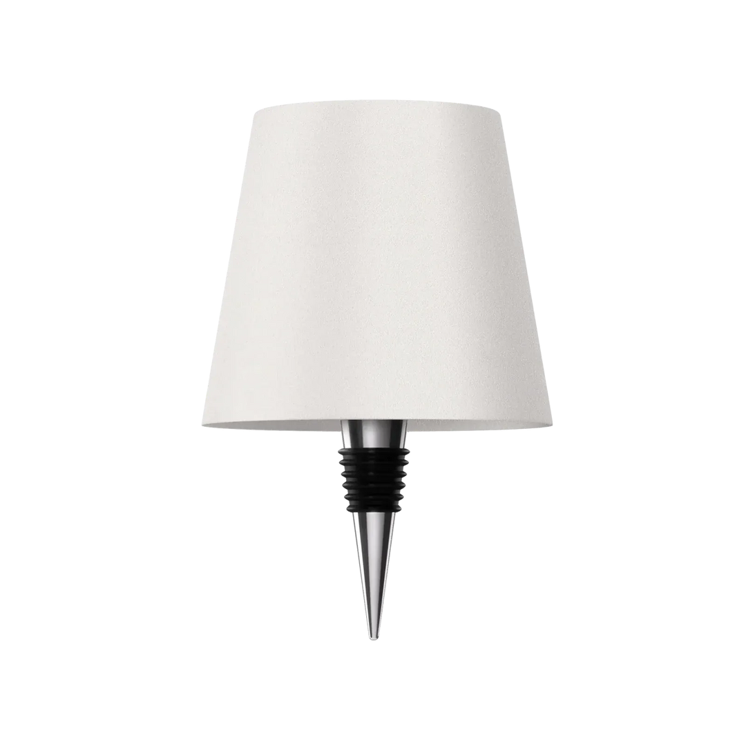 White bottle lamp with a chrome and black rubber bottle stopper on a white background.
