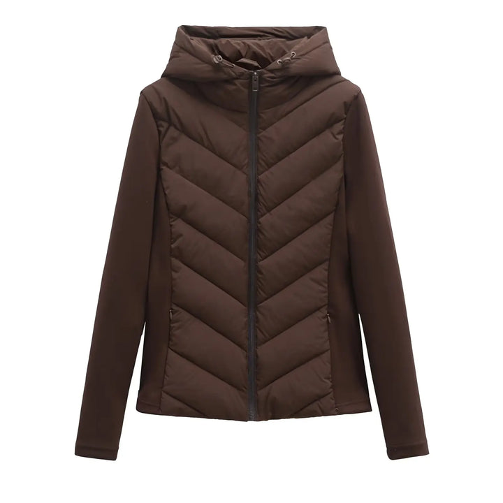 Women's brown hooded padded winter jacket detail with chevron quilting and zippered pockets.