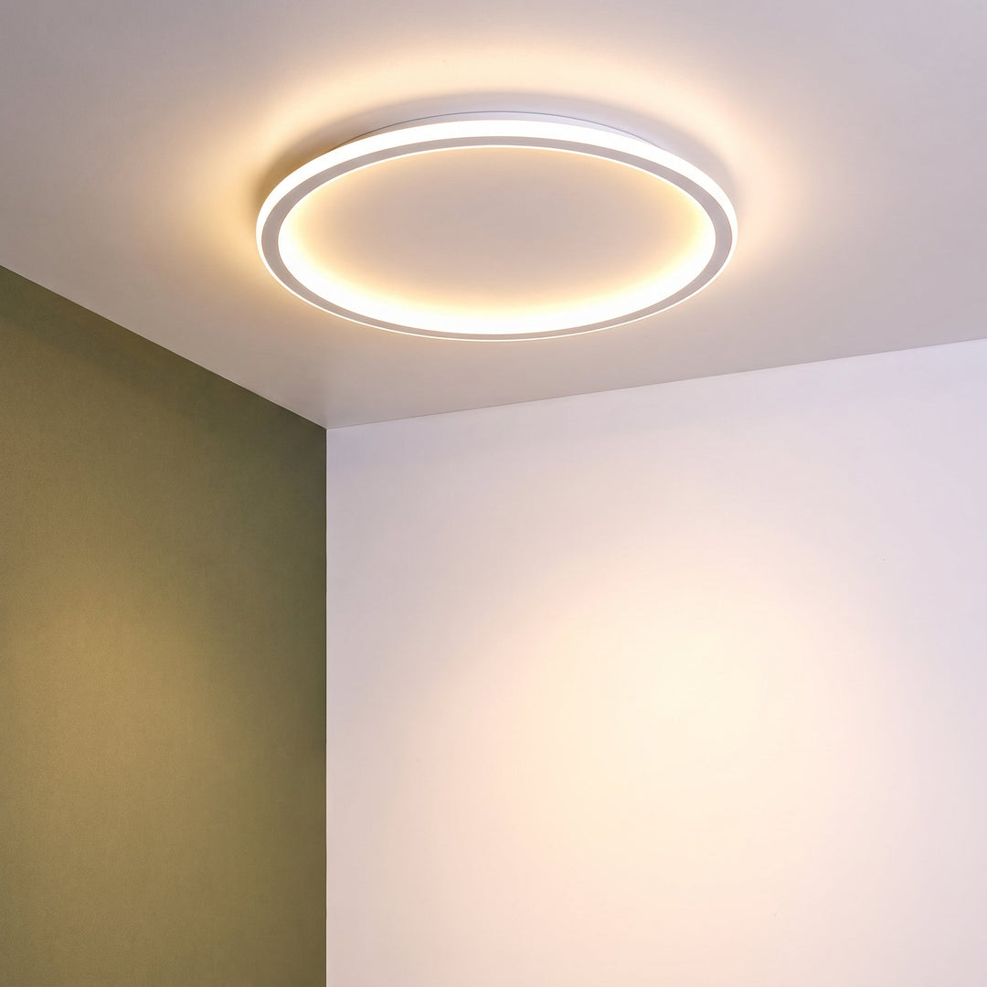 Low-angle view of the white ring light shining warmly