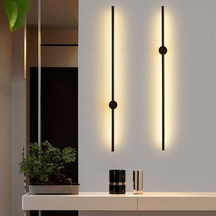 Black linear wall light detail with slim vertical LED bars and round mounts.