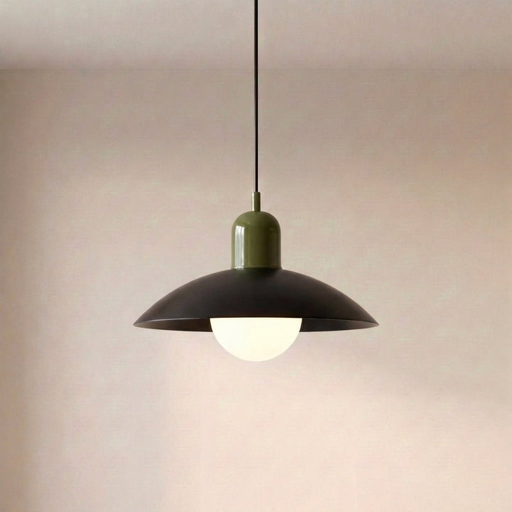 Pendant lamp with a dark wide dish shade, glossy olive green cap and a glowing frosted white globe hanging from a black cord. 22