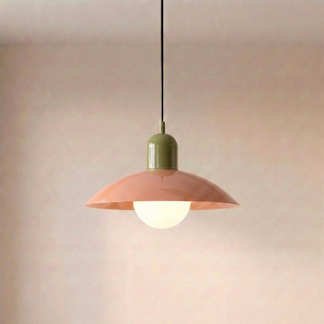 Close view of a beige Macaron Pendant Light with the bulb lit beneath the shade.