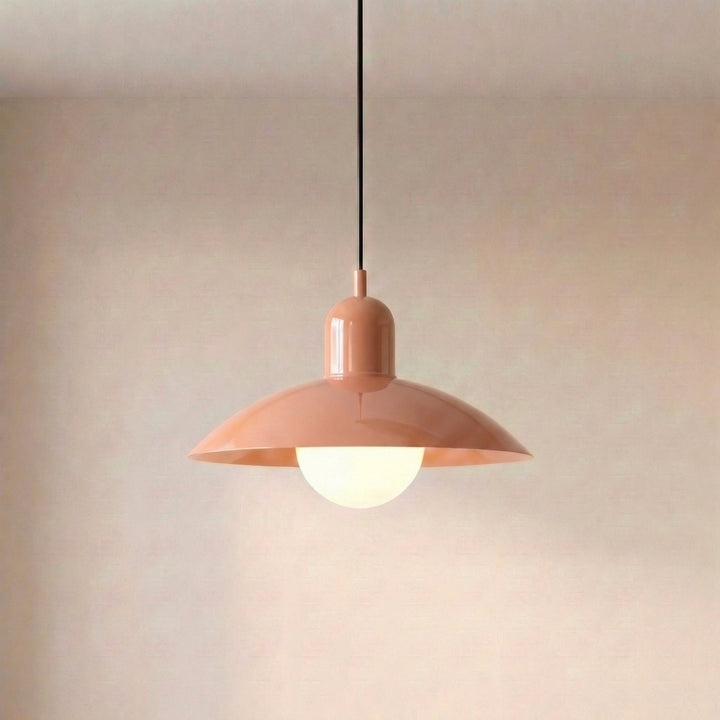 Close view of a beige Macaron Pendant Light with the bulb lit below.