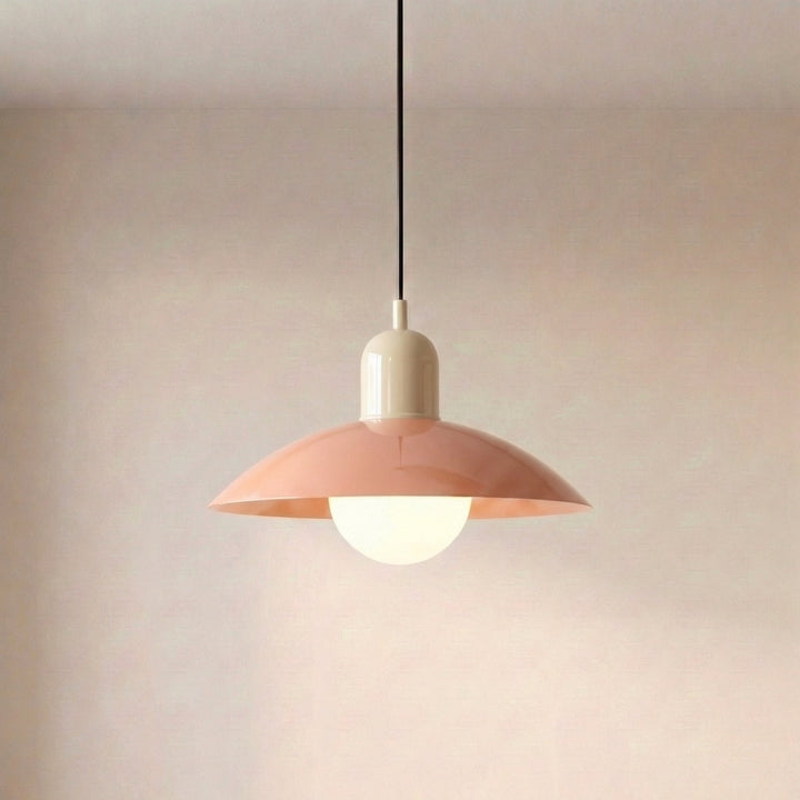 Close view of a beige Macaron Pendant Light with the bulb glowing under the shade.