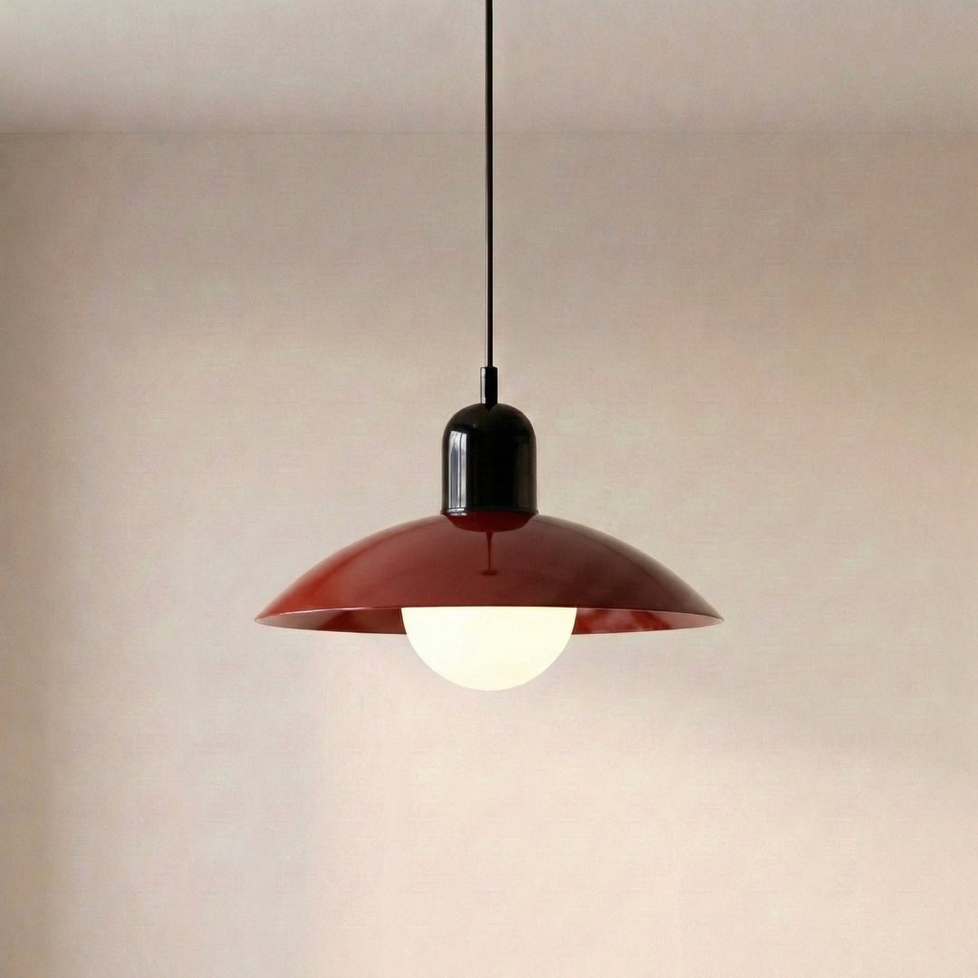 Close view of a beige Macaron Pendant Light with the bulb glowing below.