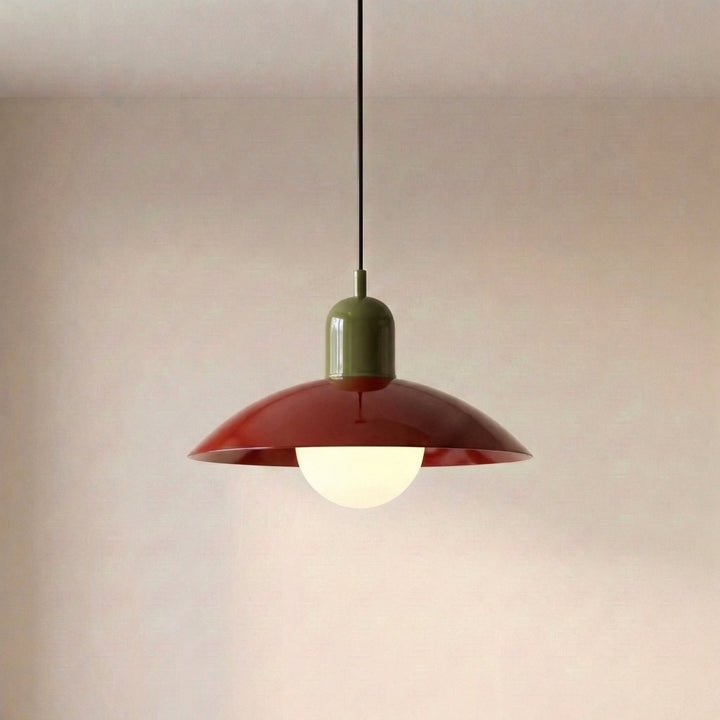 Close view of a beige Macaron Pendant Light with the bulb glowing beneath the shade.