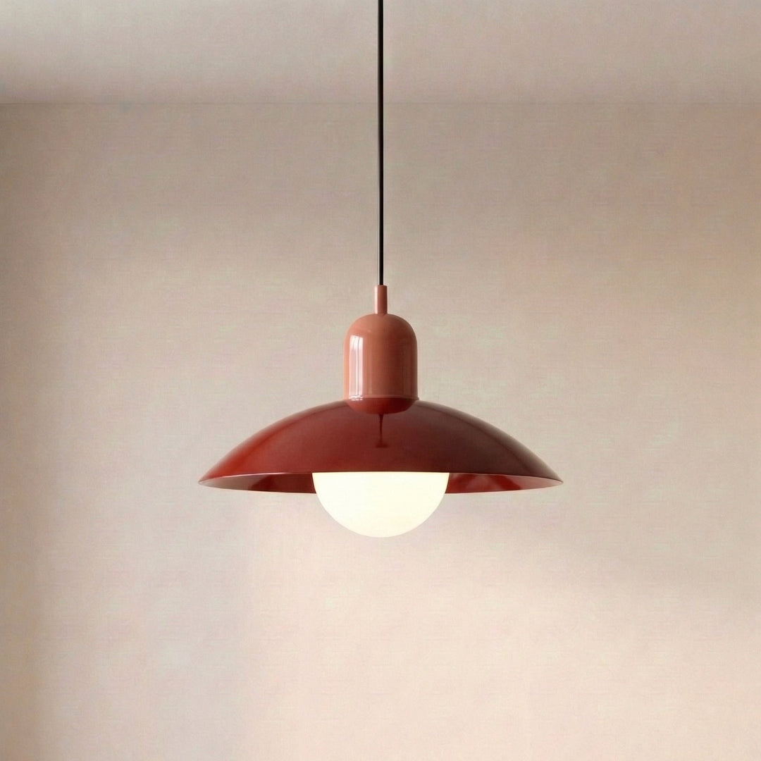 Close view of a beige Macaron Pendant Light with the bulb lit below.