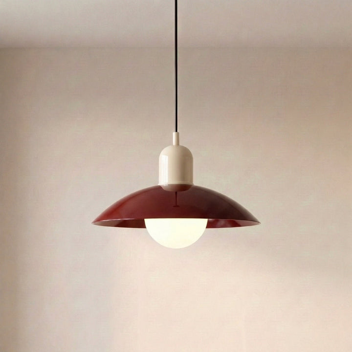 Close view of a beige Macaron Pendant Light with the bulb glowing underneath.