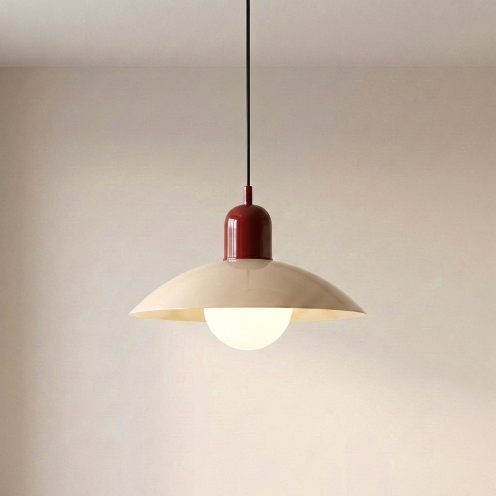 Beige Macaron Pendant Light with a black cord against a plain wall.