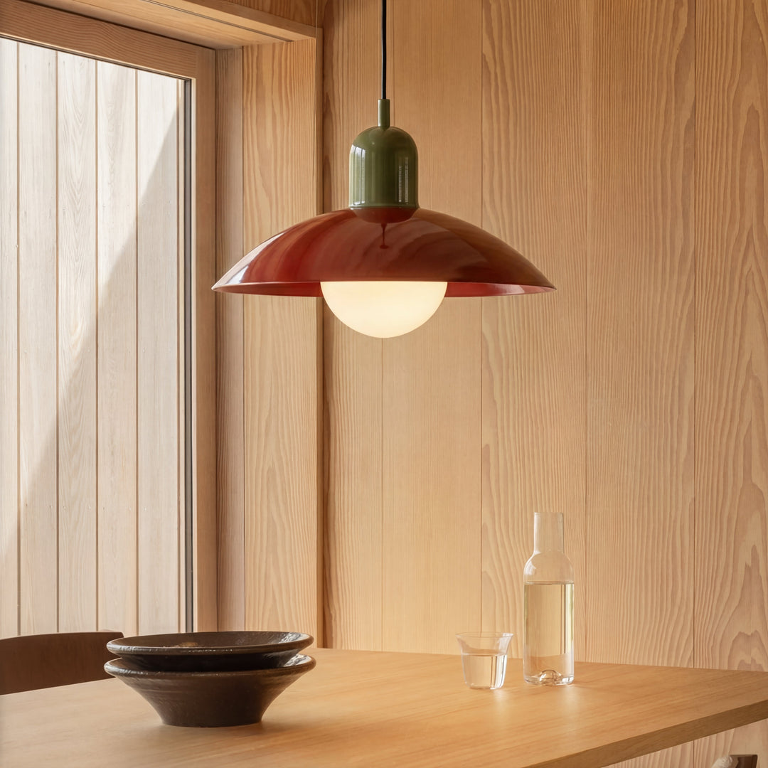Beige Macaron Pendant Light above a dining table with bowls and a carafe.