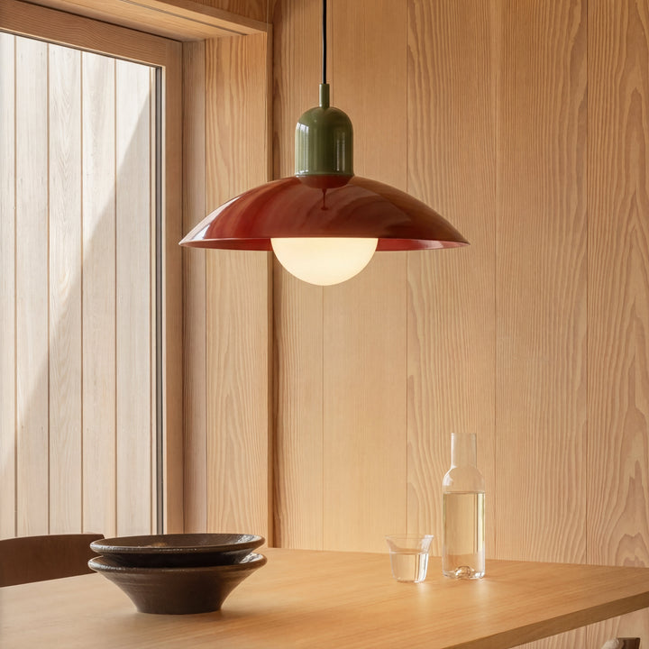 Beige Macaron Pendant Light above a dining table with bowls and a carafe.