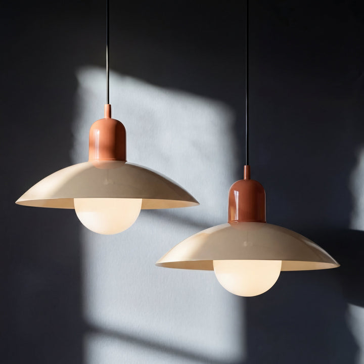 Two beige Macaron Pendant Light fixtures side by side against a dark wall.