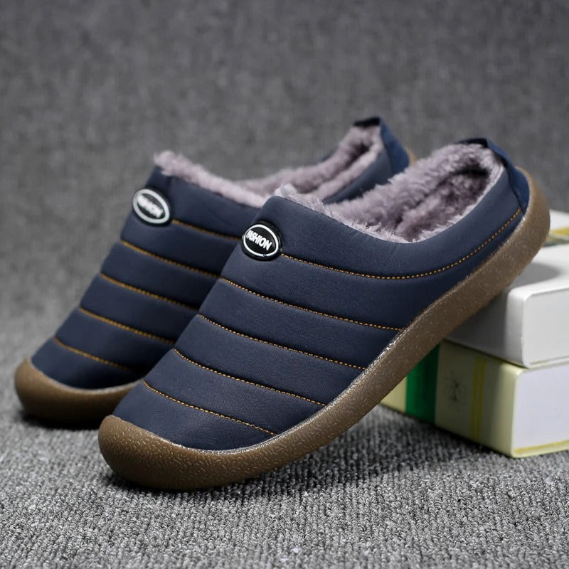Pair of navy blue quilted slippers with fluffy lining, one leaning on books 5
