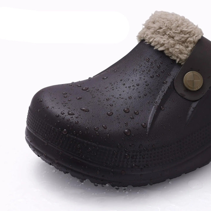 Close-up of the clog toe covered in water droplets, showing its waterproof surface 4