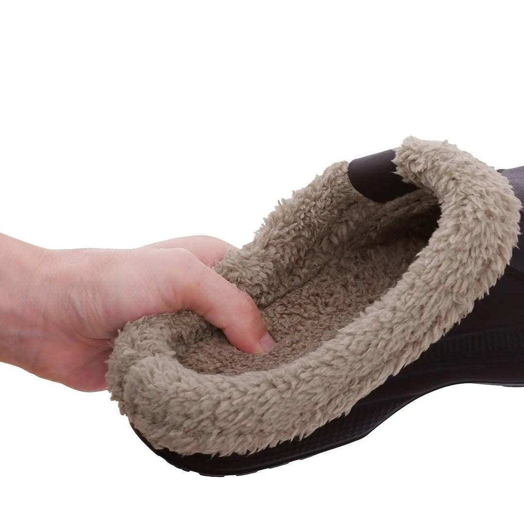 Hand pressing into the thick, soft plush lining inside the clog 5