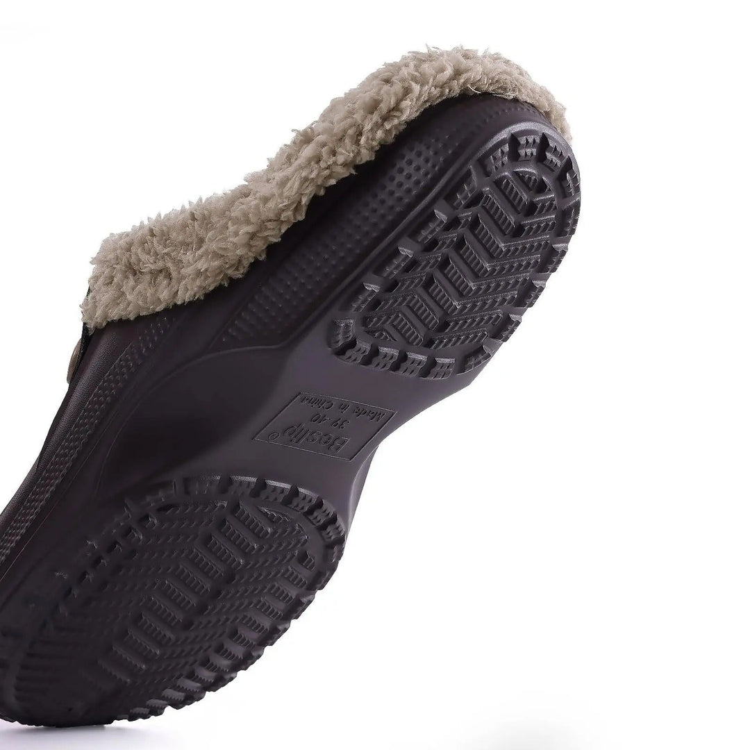 Underside of the clog showing the deep chevron tread of the non-slip sole 6