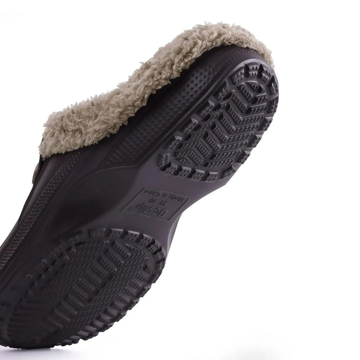 Underside of the clog showing the deep chevron tread of the non-slip sole 6