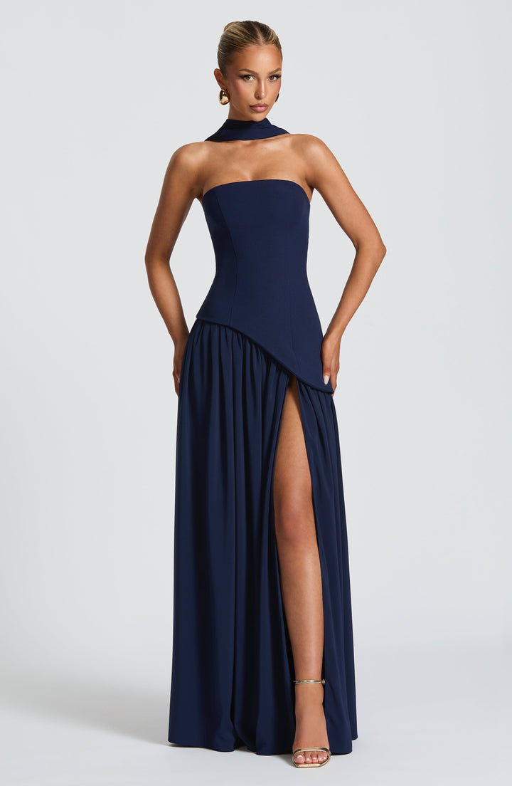 Another view of the navy blue version with neck scarf, asymmetric waist and thigh slit.