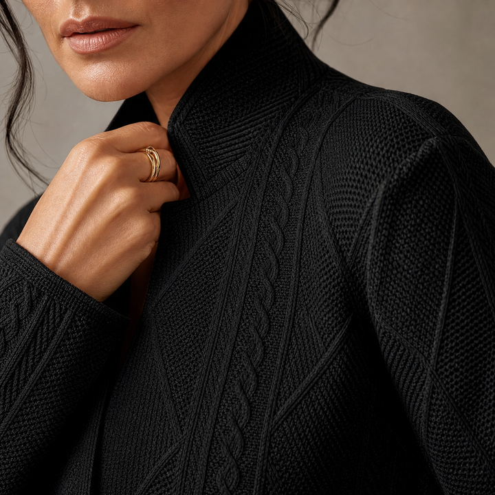 Close-up of the black blazer's stand collar and braided cable and diamond knit texture 12