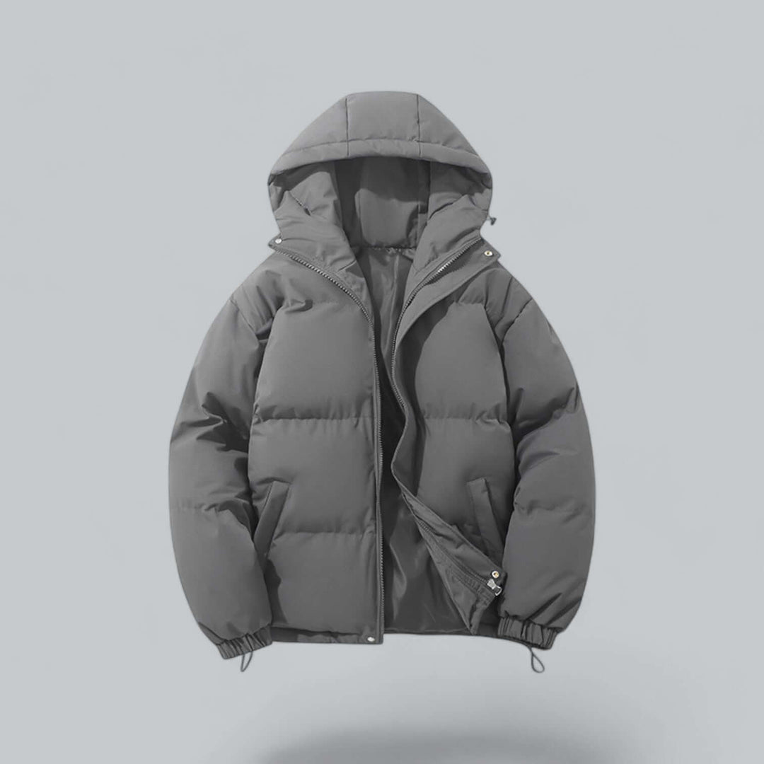 Dark gray quilted puffer jacket with hood, front view, partly unzipped to show the gray lining and side pockets
